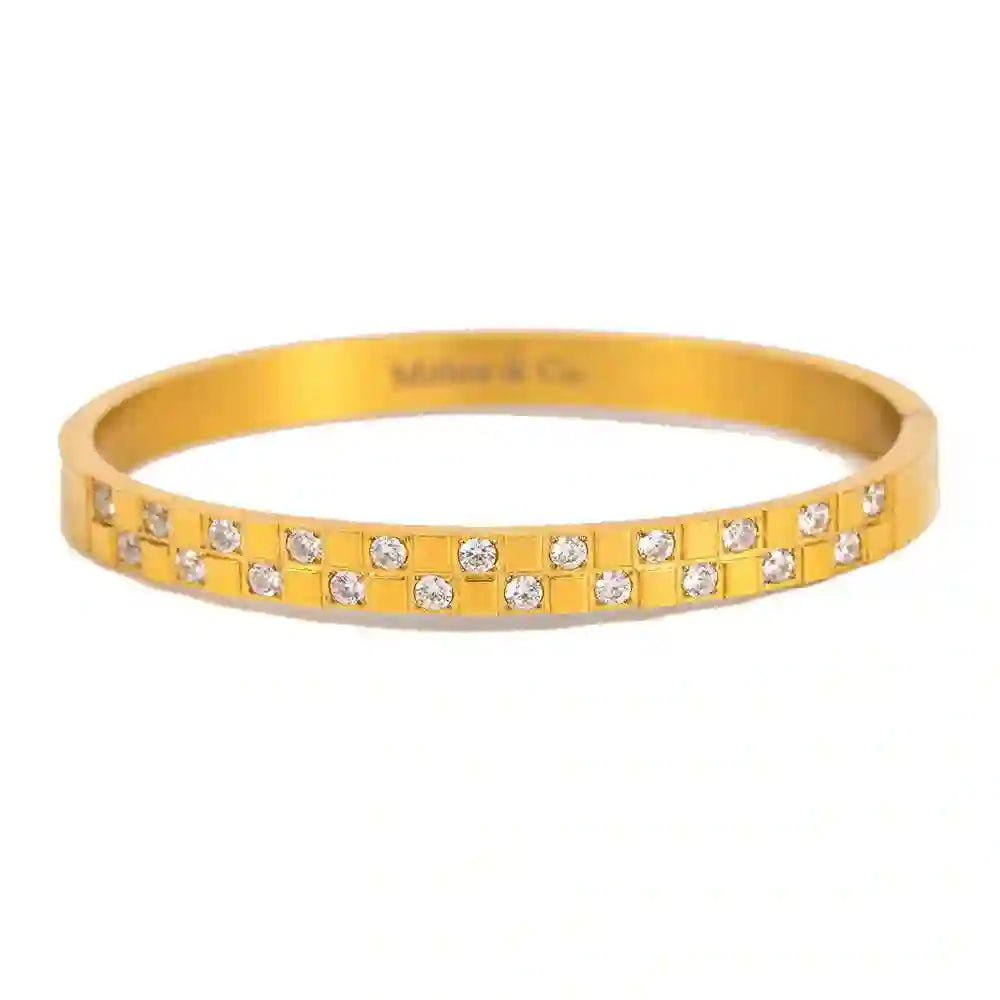 Studio shot of Waterproof 18k Gold plated Bentley Cuff. Shop Gold Hinged Bangle Online at Mithra and Co.