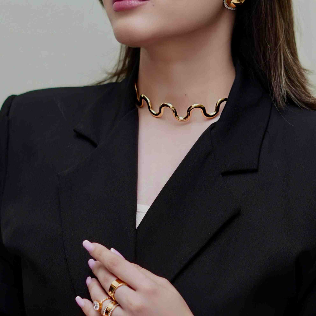 Girl wearing Cascade Necklace. 18k Gold Plated Fluid Wavy Collar Sculptural Choker Necklace.