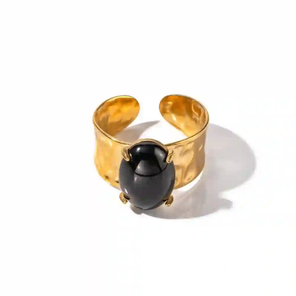 Studio shot of circa ring. 18k gold plated Hammered Cuff and Onyx Station Band design Ring.