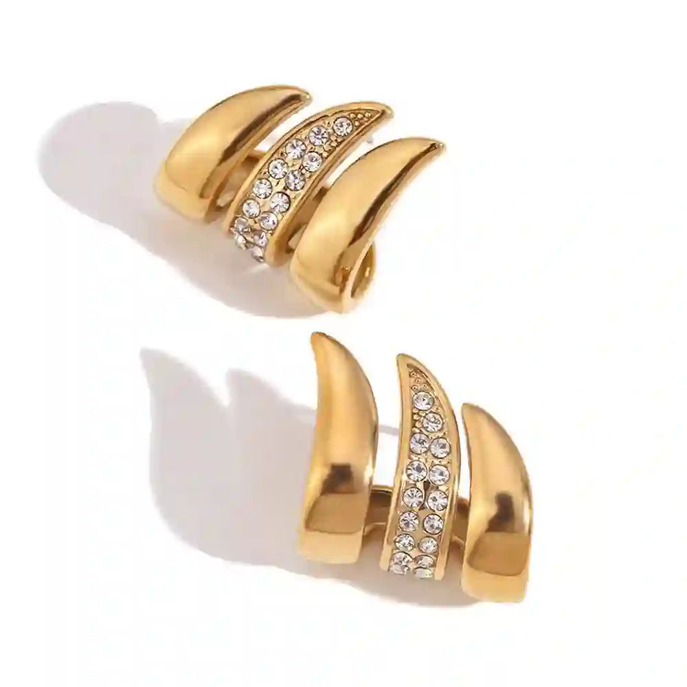 Studio shot of 18k Gold Plated Crystal Detailed Flame Stud Earrings having Fire Flame Silhouette with Zircons. Shop  at Mithra and Co.
