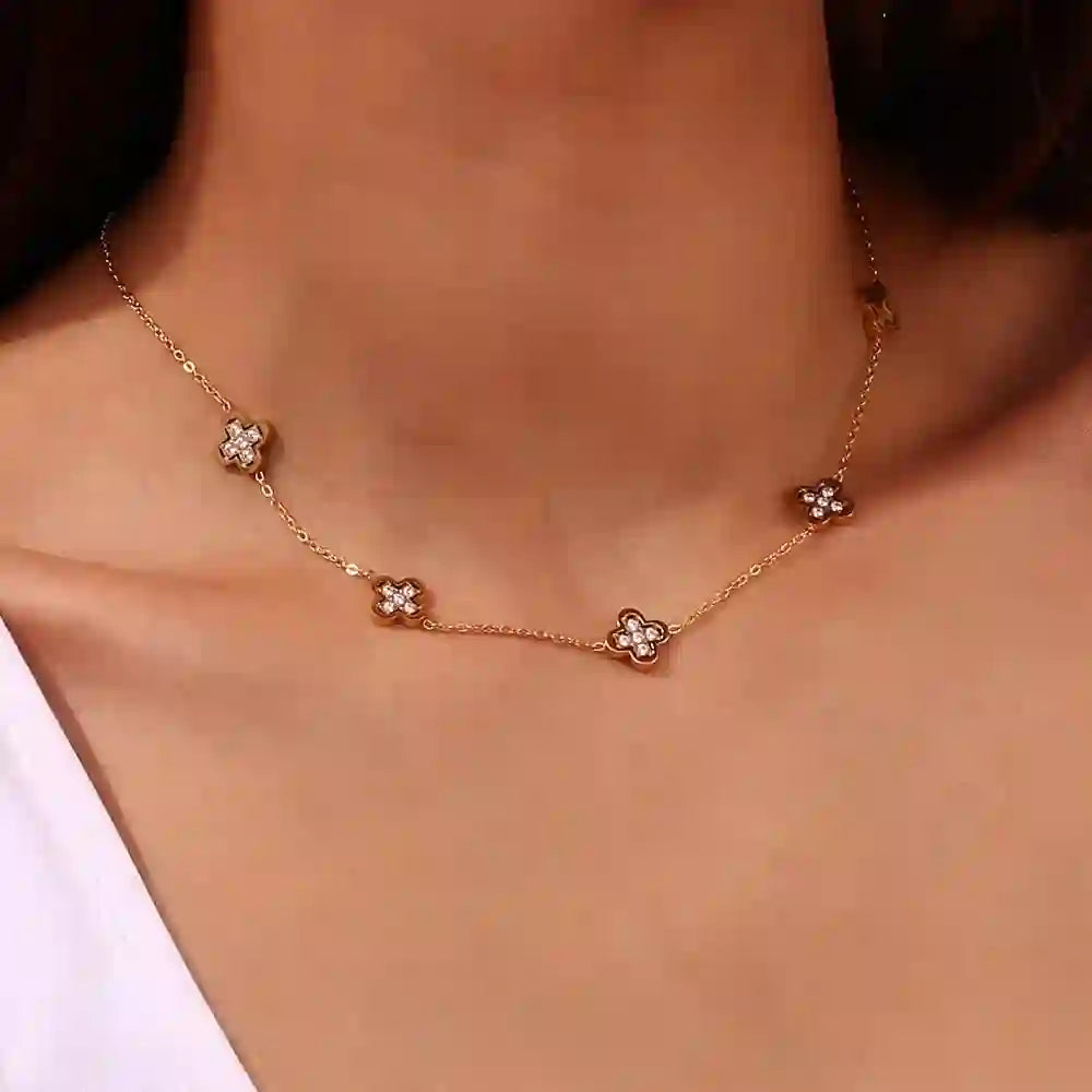 Closeup of a Girl wearing 18k Gold Plated GIlded Clover Necklace with 5-Motif Zircon-Inlaid Clover Architecture.