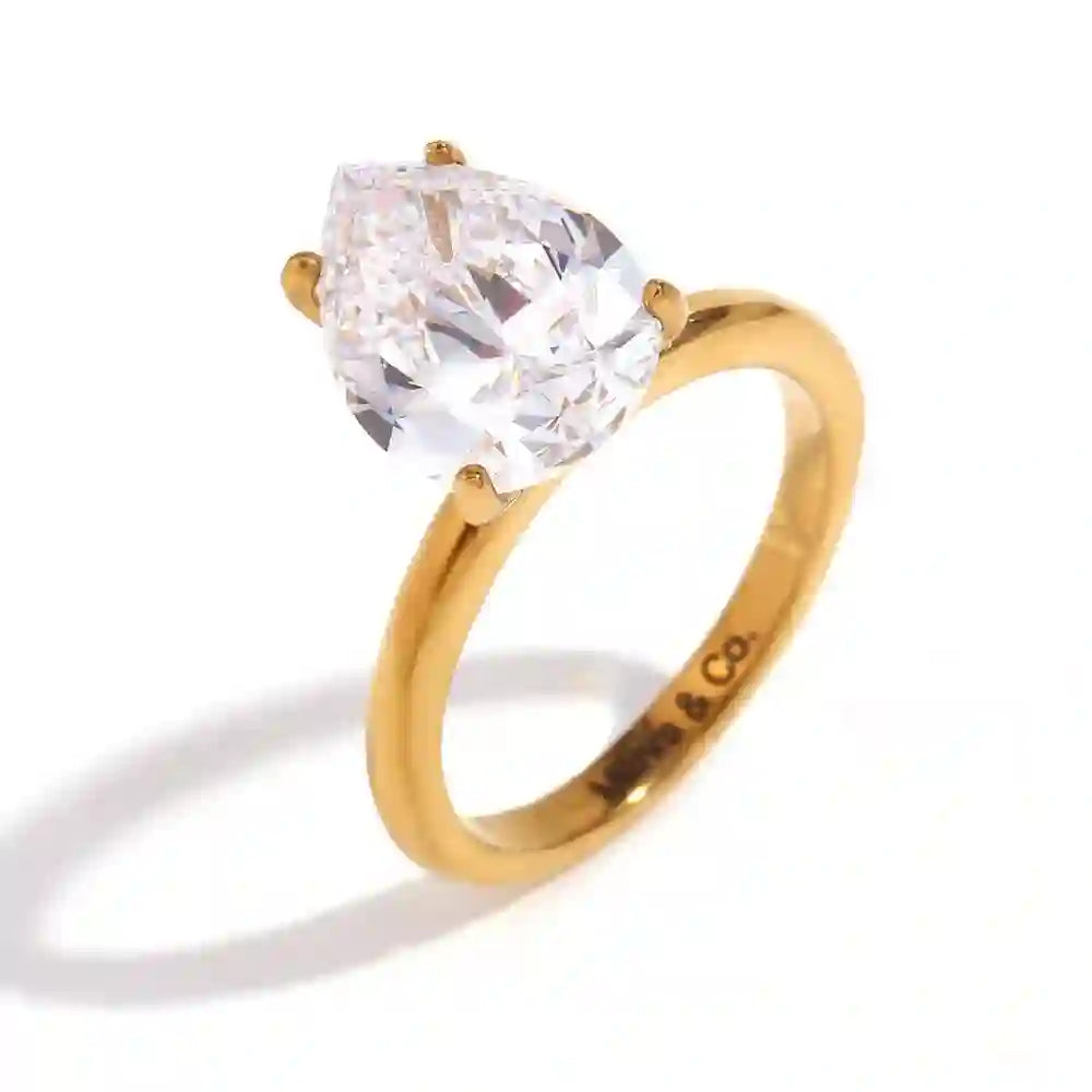 Studio shot of Granduer Drop. Solitaire Pear-Cut Cubic ZIrconia Gemstone Ring.
