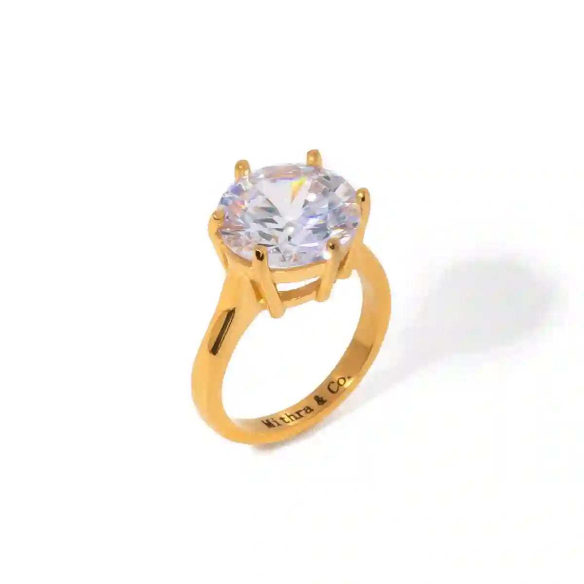 Studio shot of Medusa ring having Six-Prong Crown Solitaire Zircon Architecture and Mithra & Co. engraved inside.