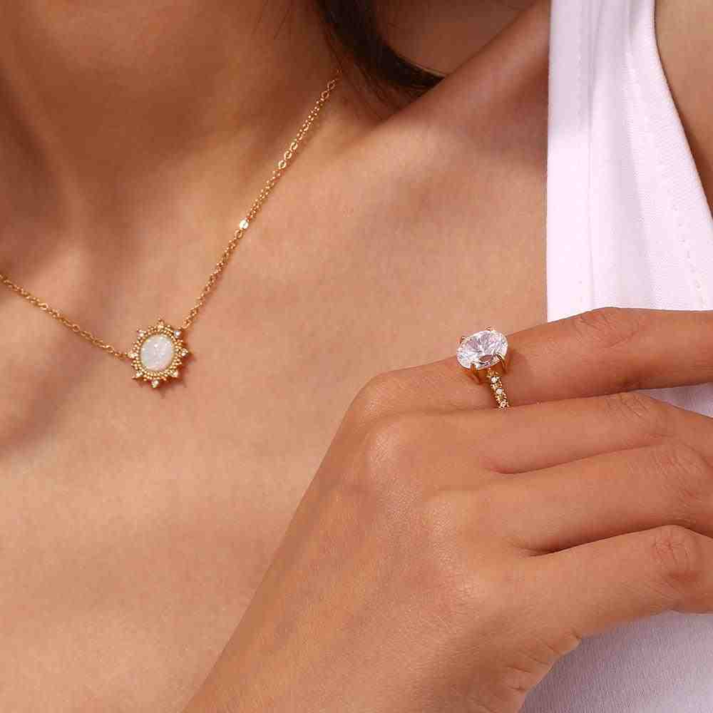 Girl Wearing Opal Neckalce and Regal Opulence RIng Having a Central Solitaire CZ Gemstone with Micro Pave Zircons.