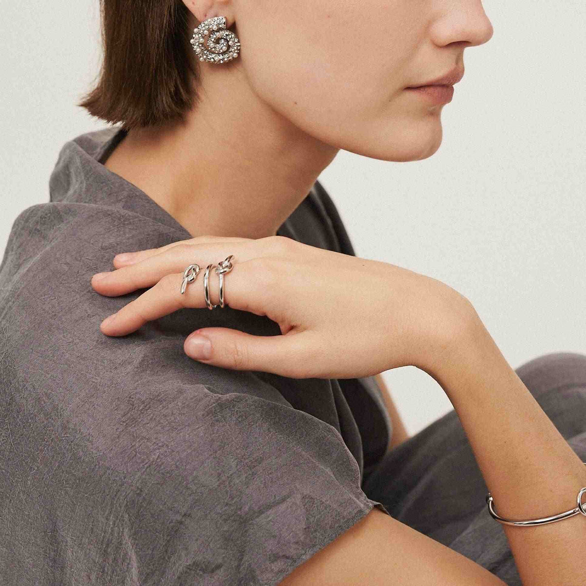 Girl Wearing Ring and Earring gold plated. Buy Now at Mithra and Co.
