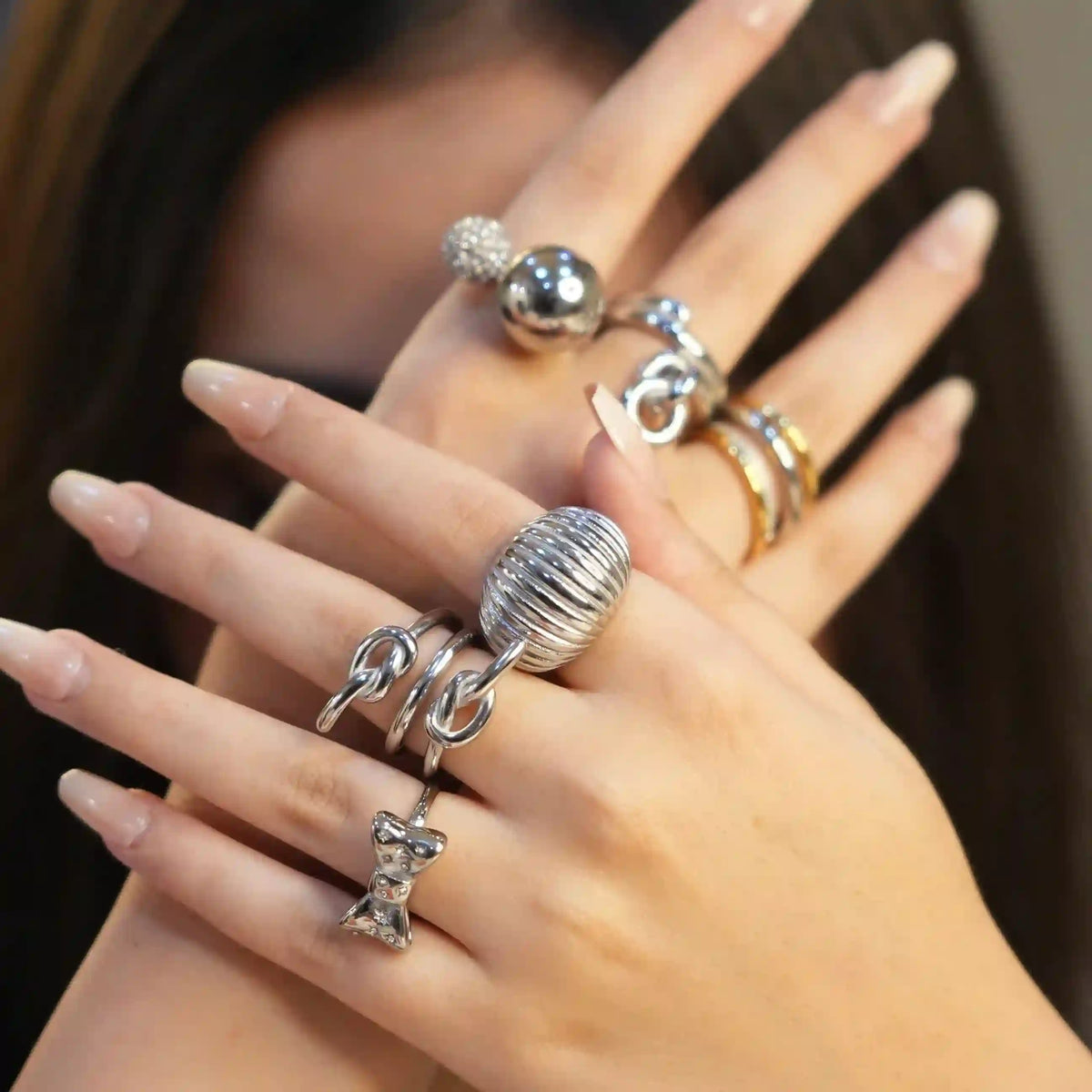 Girl Wearing sterling silver plated rings. Shop at Mithra and Co.