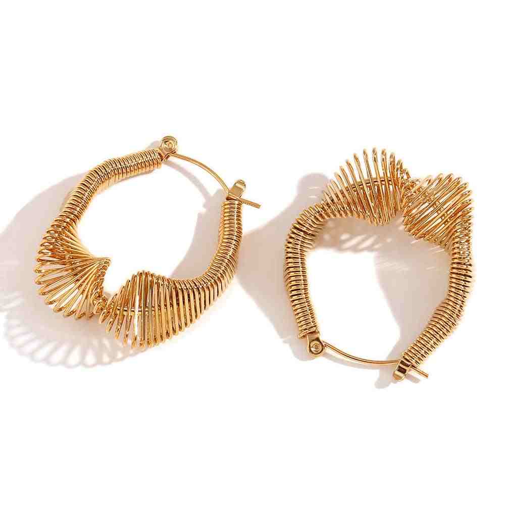 Studio shot of Sculptural Wire Mesh Hoop Spring Hoop Huggie Earrings - Vela. 18k gold Plated. Buy Online at Mithra and Co.