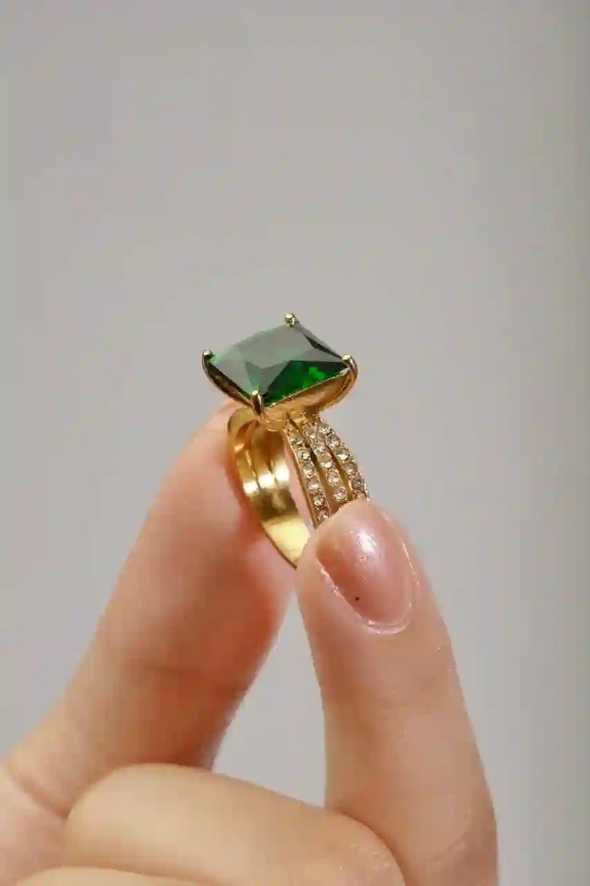 holding Aura Ring Gold Plated Square Emerald Gemstone Engagement Ring.