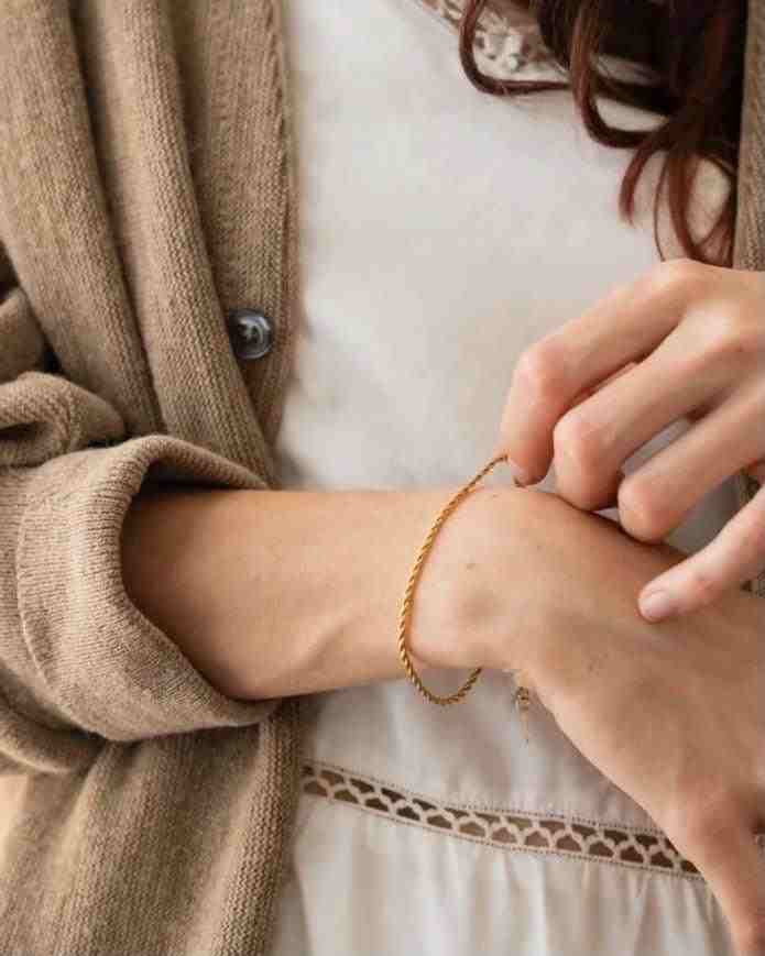 Girl wearing Stainless Steel Braid - 18k Gold Plated Twist chain bracelet. Shop Online.