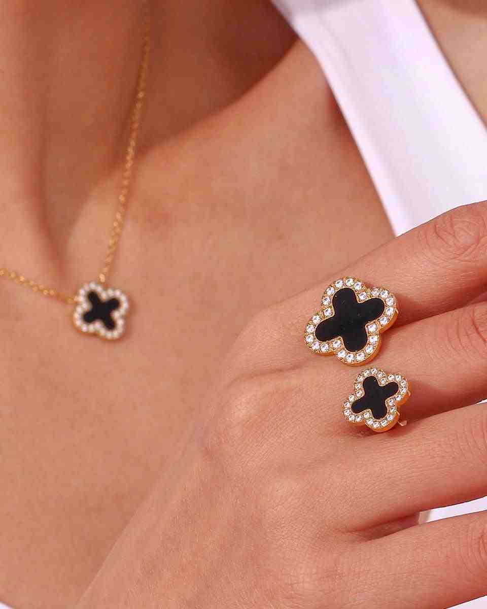 Girl wearing Midnight clover necklace and ring that features an Open Cut Adjustable Dual Black Motifs that are bordered with pave zircons.